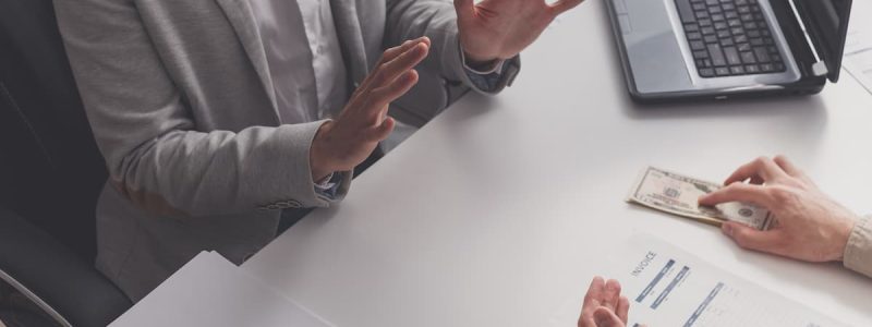 disgusted-male-employee-refusing-to-take-bribe-2022-11-06-22-40-41-utc (1)
